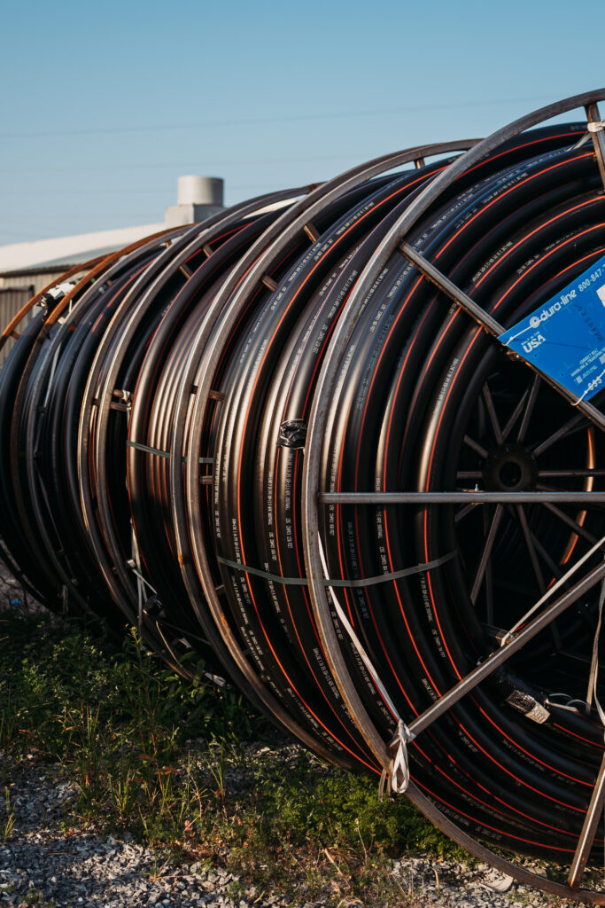 Dura-Line fiber and utility conduit reels staged for installation
